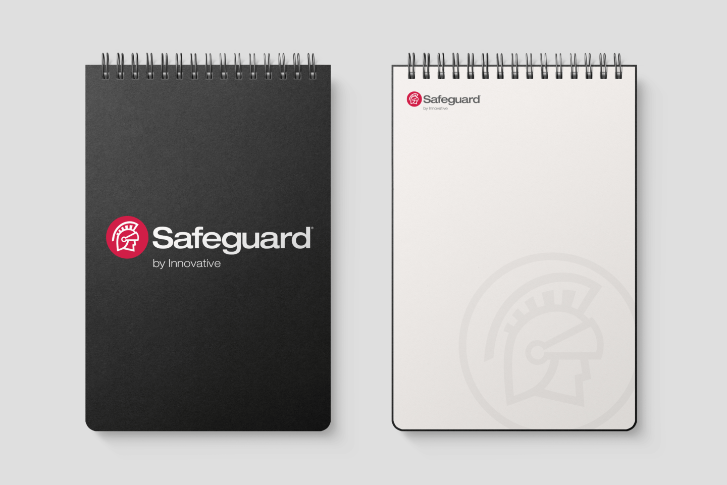 Two views of a Safeguard by Innovative notebook - one open and one closed.