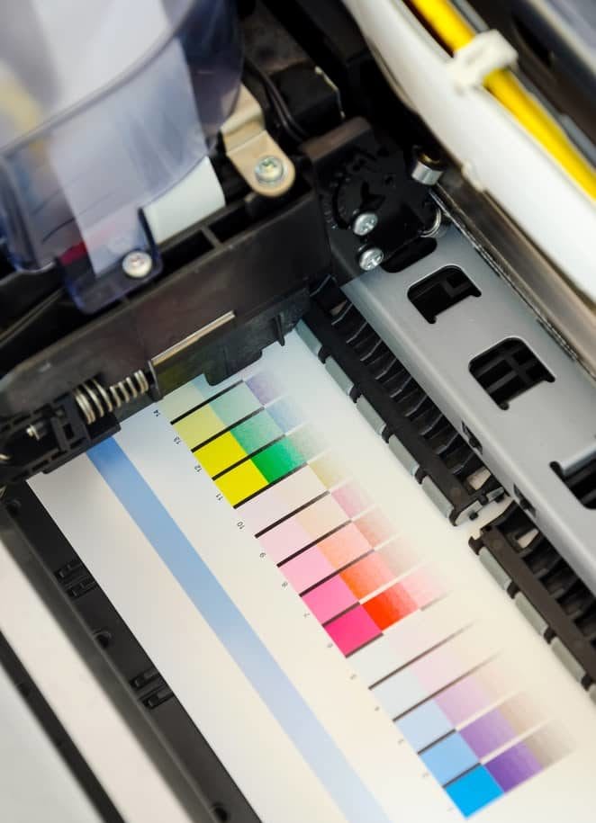 The inside mechanisms of a commercial printing machine.