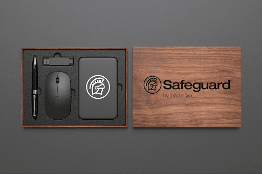 A custom Safeguard by Innovative care package with a pen, computer mouse, thumb drive, and portable charger. 